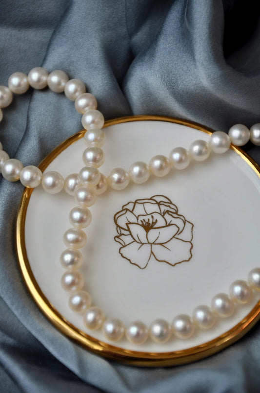 Floral blossom trinket dish styled with a necklace as a vanity jewellery tray