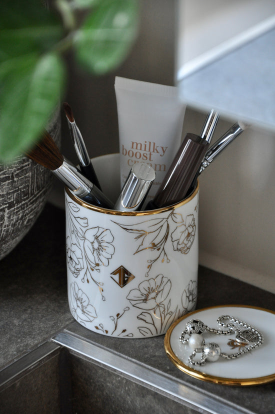 Stylish bone china storage pots ideal for organizing makeup brushes, bathroom essentials, or small items. These elegant pots can be paired with a matching trinket dish, offering both functionality and a touch of luxury to your decor. Perfect for adding a refined, organized touch to any space.