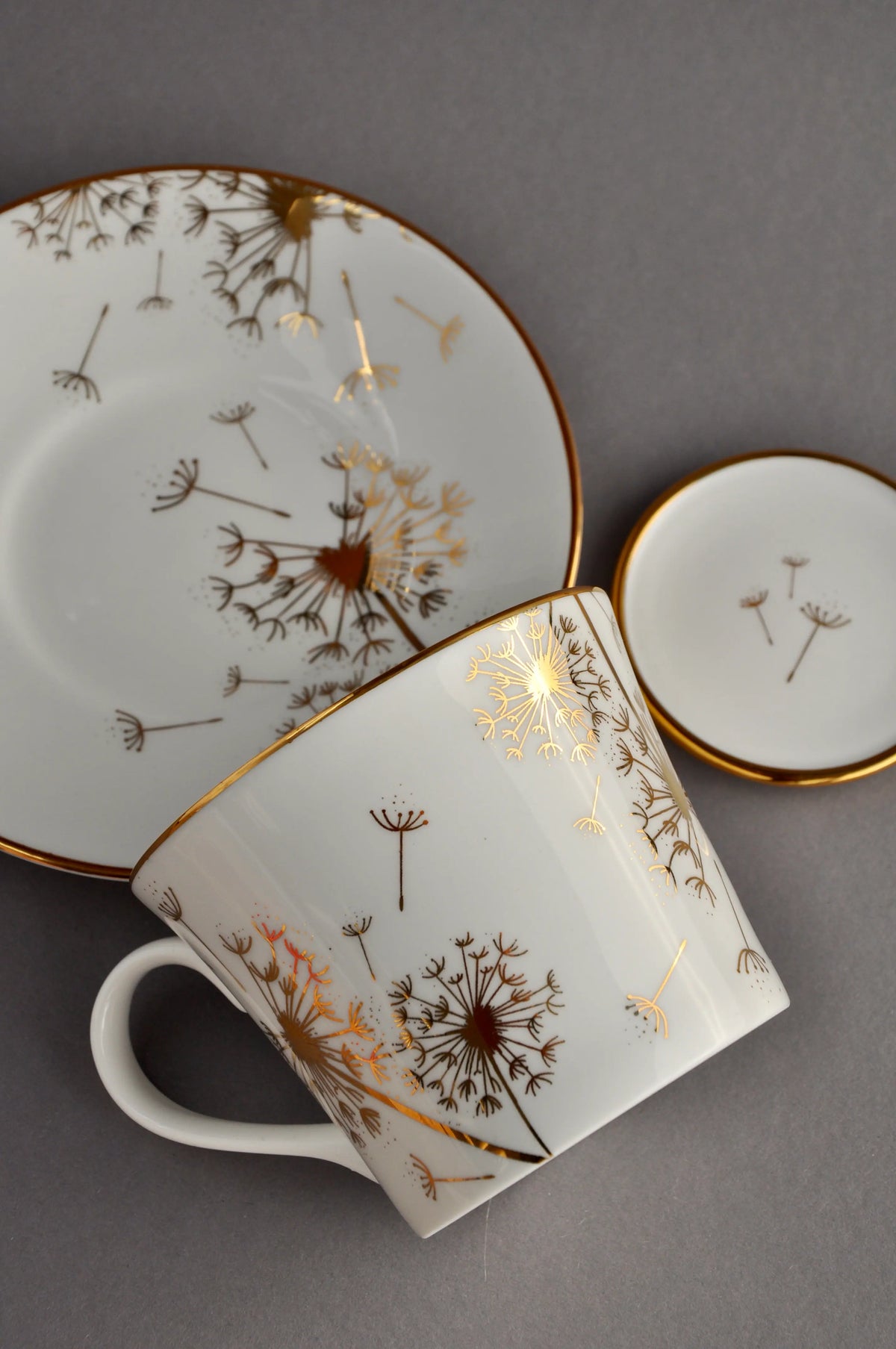 Top view of a dandelion fine bone china cup, saucer and matching mini trinket dish set