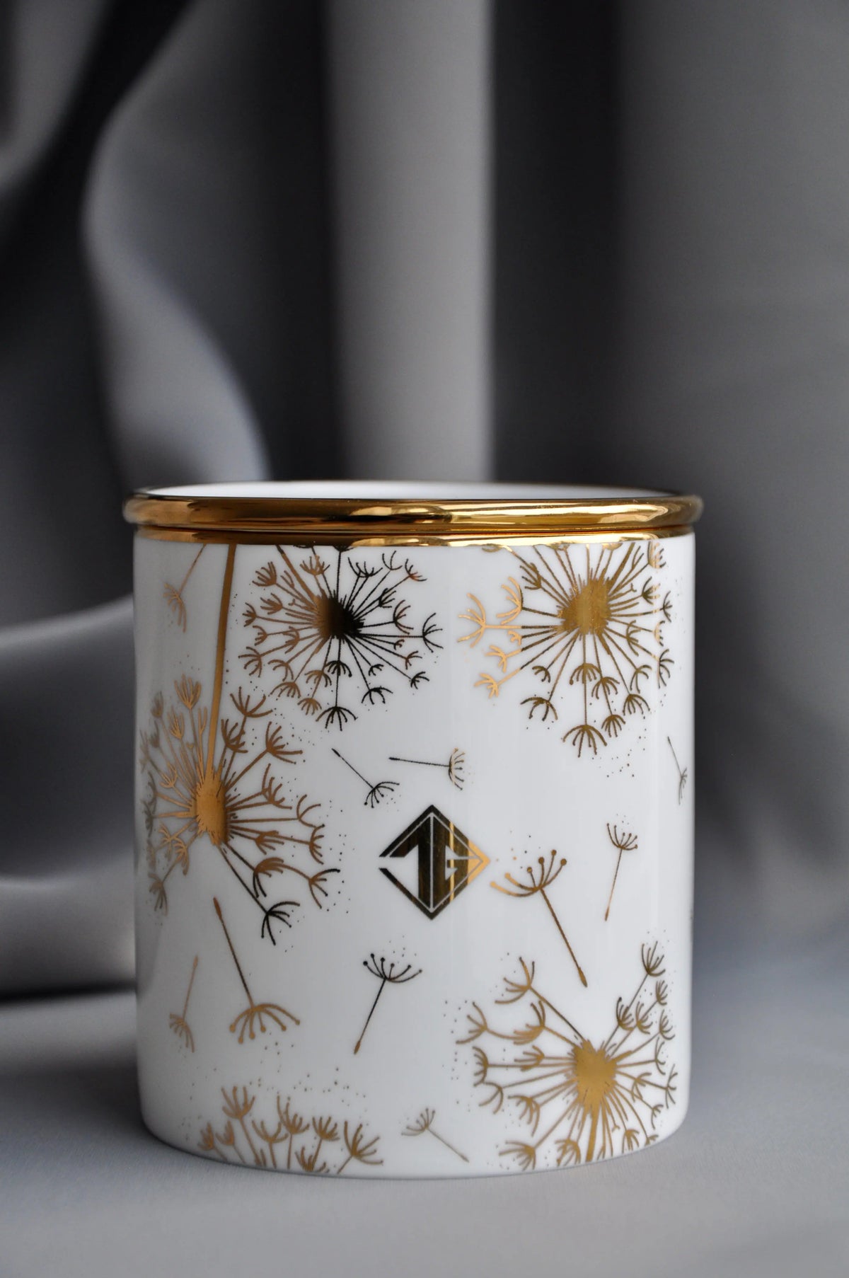 Frankincense & Myrrh fine bone china candle vessel styled with a matching lid