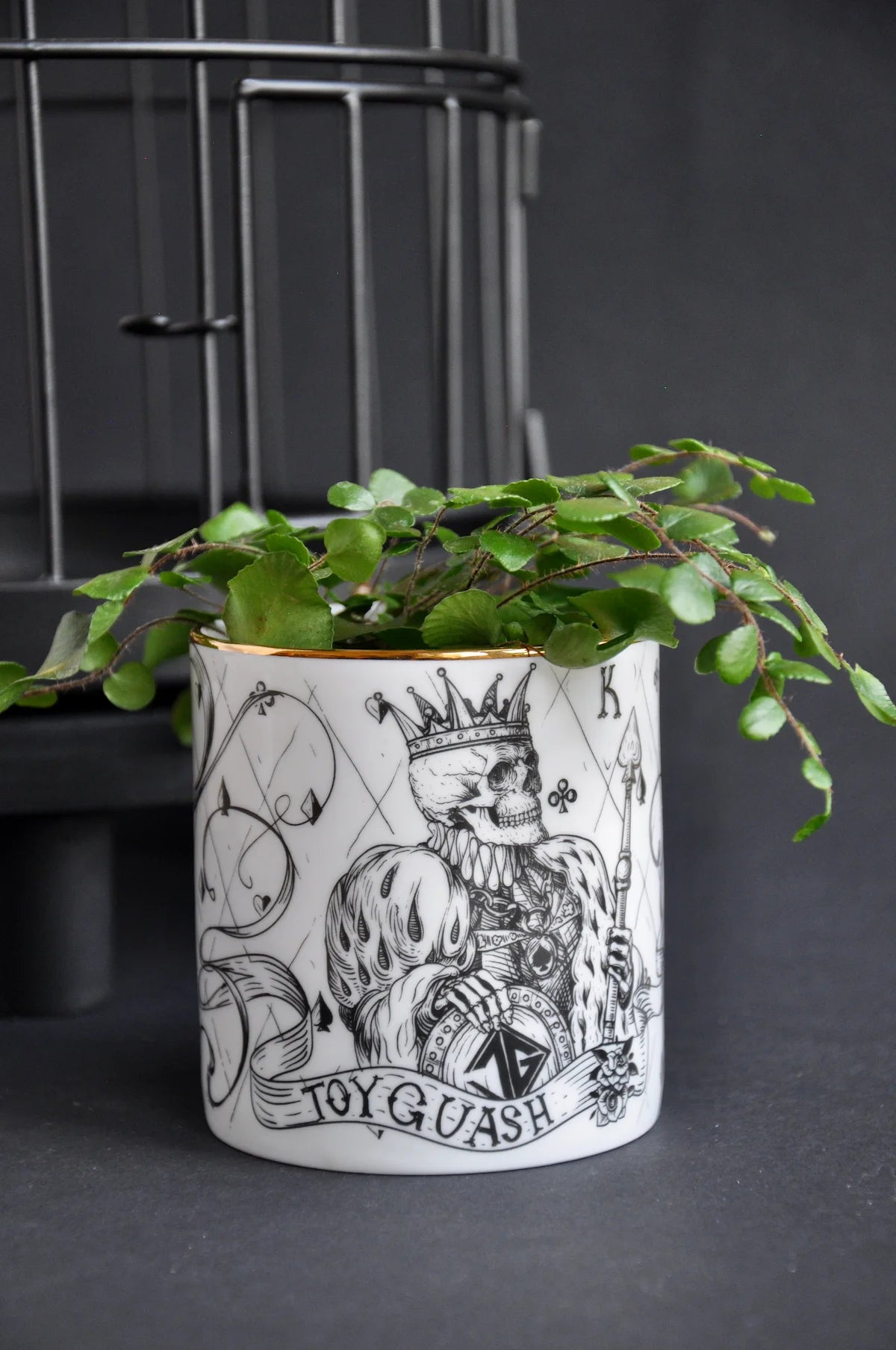 Fine bone china pot styled as a ceramic cachepot for small plants