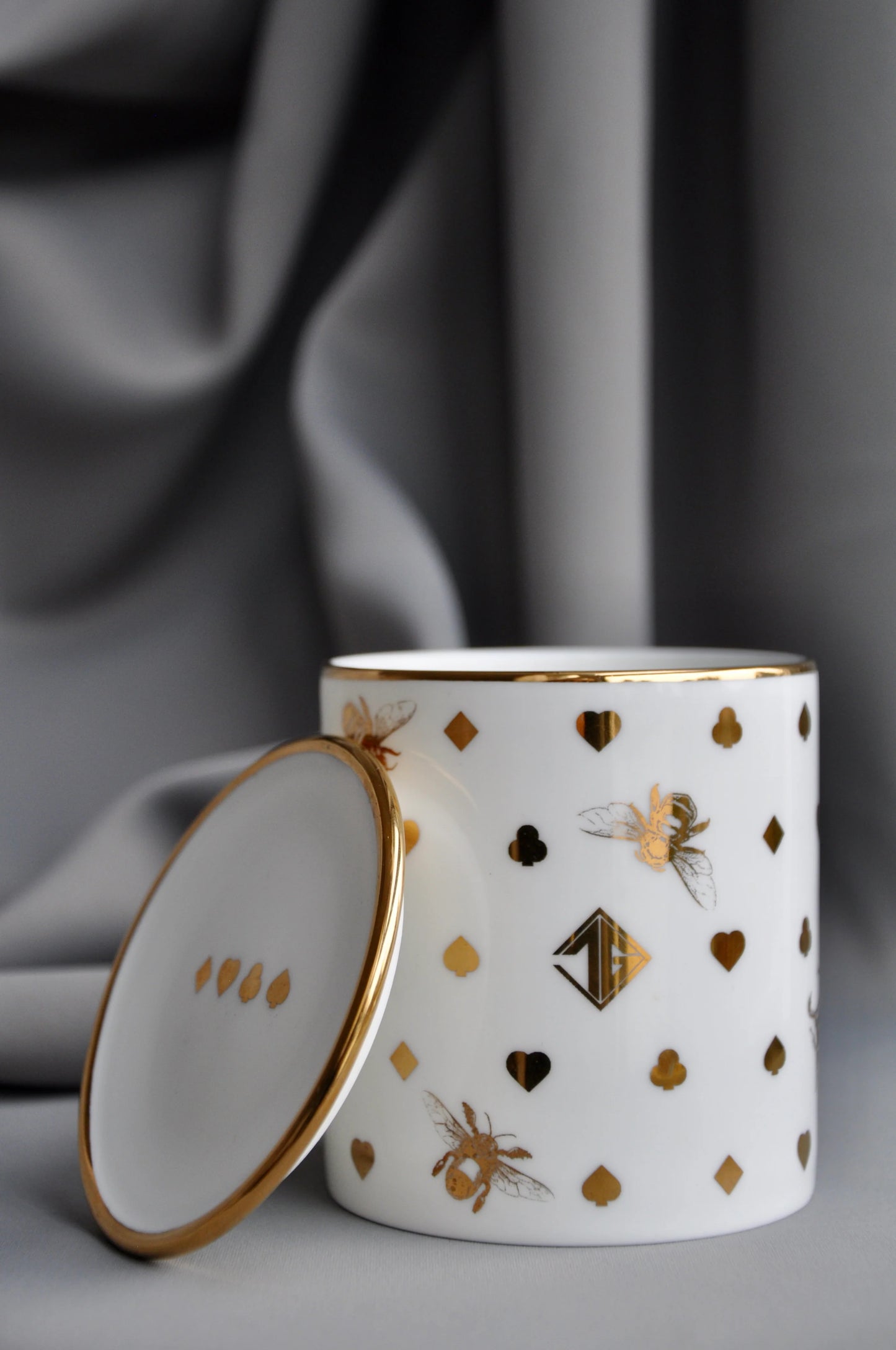 Fine bone china pot presented next to a matching porcelain lid.