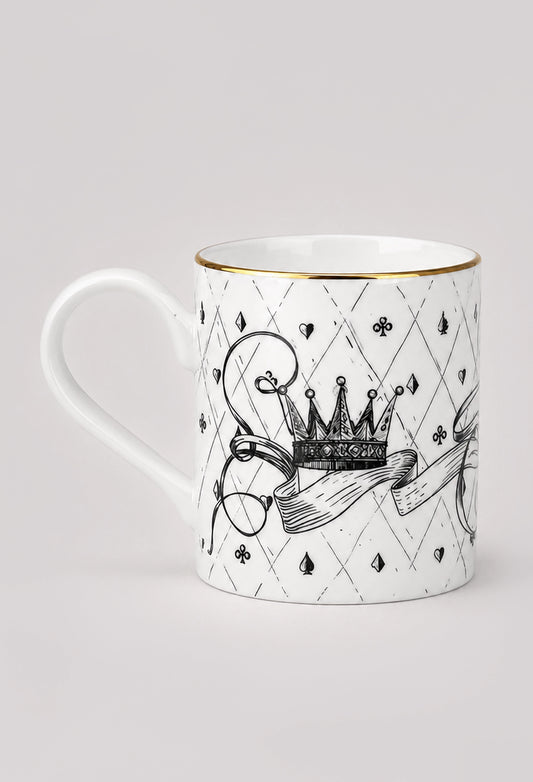Reverse side of white fine bone china mug showing black crown illustration and gilded gold rim