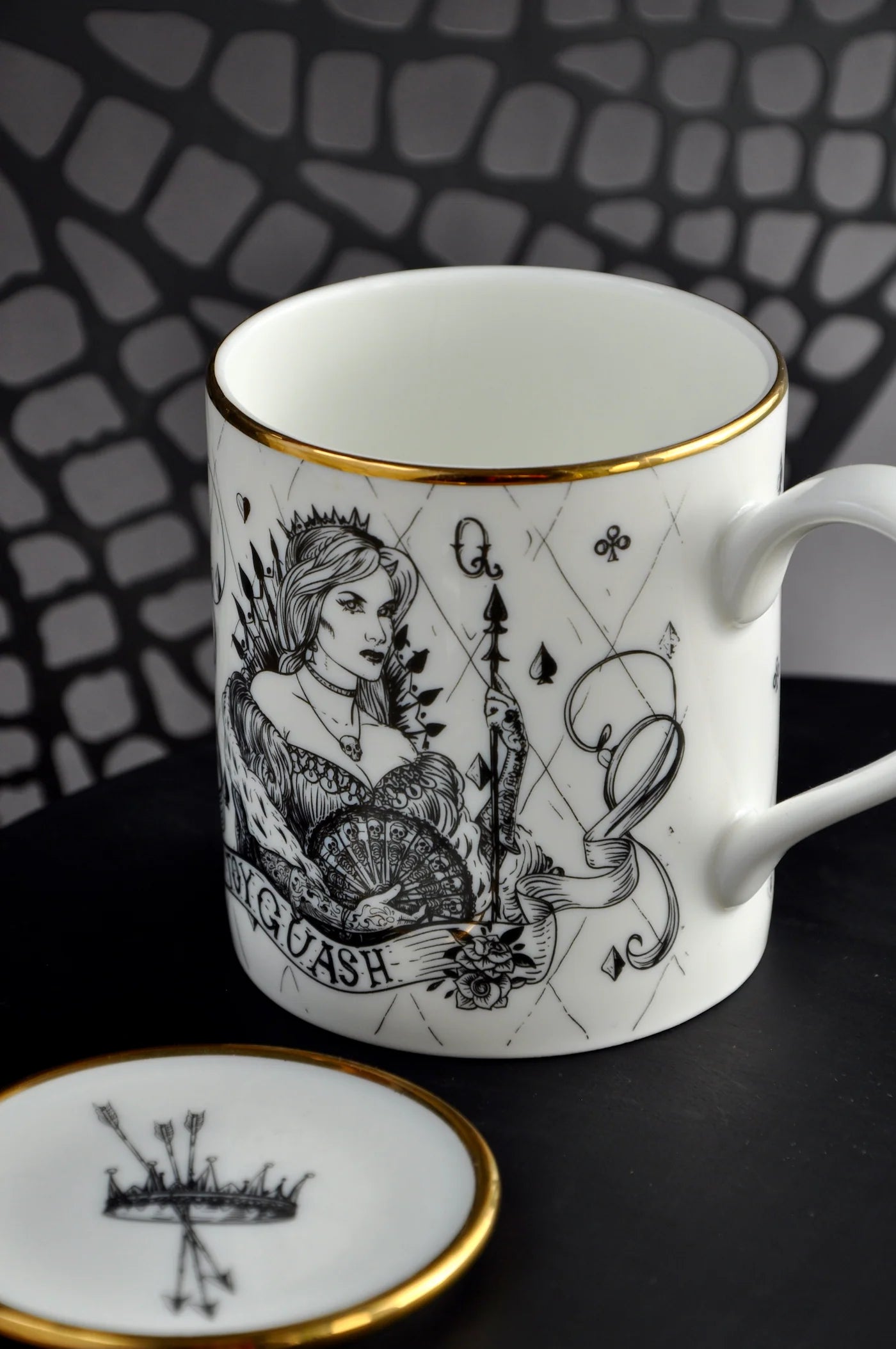 Illustrated bone china mug paired with matching spoon rest