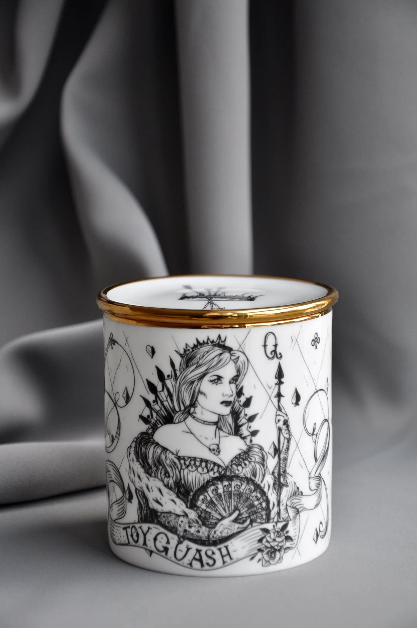 Fine bone china pomegranate candle shown closed with matching lid