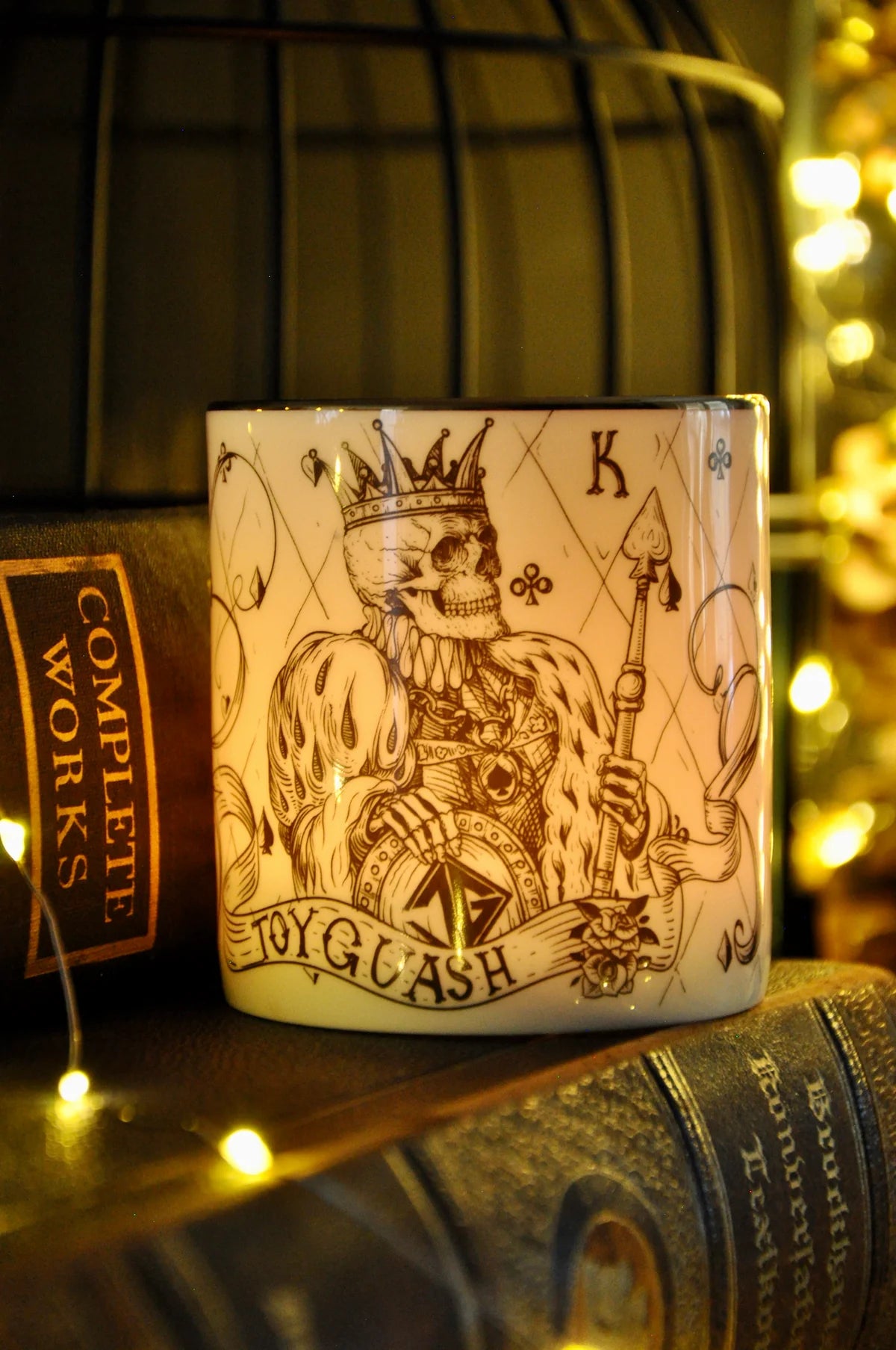 Lit Amber and Tonka candle showing warm light glowing