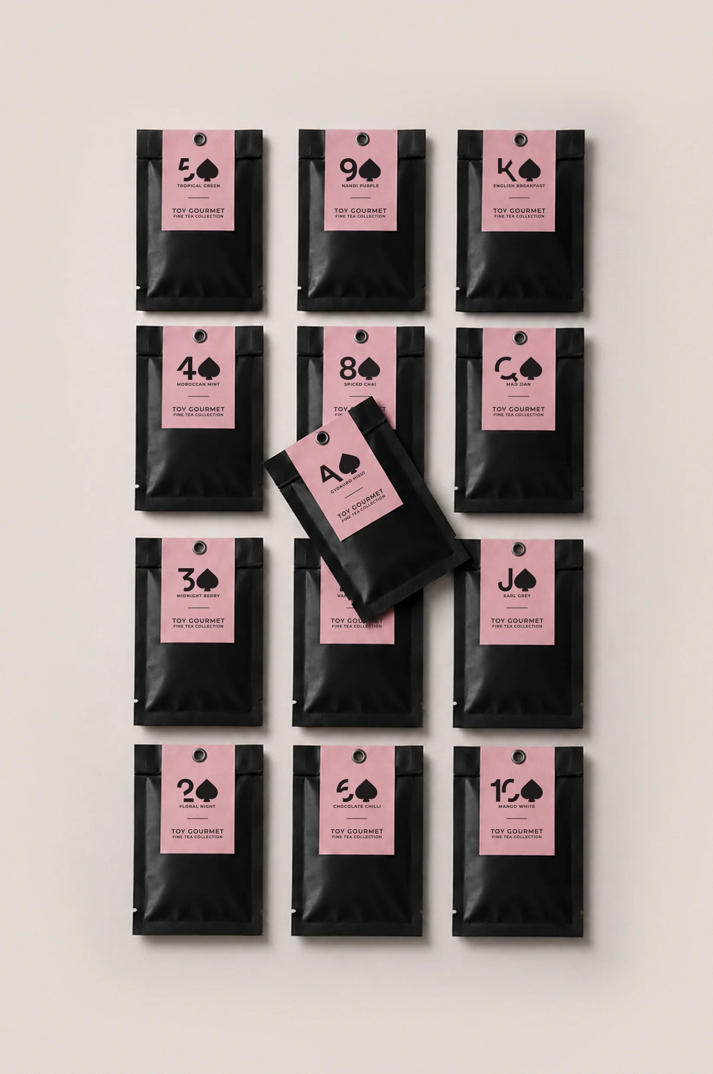 Thirteen loose leaf tea sachets from the Toy Gourmet tea sampler, featuring the complete tea collection