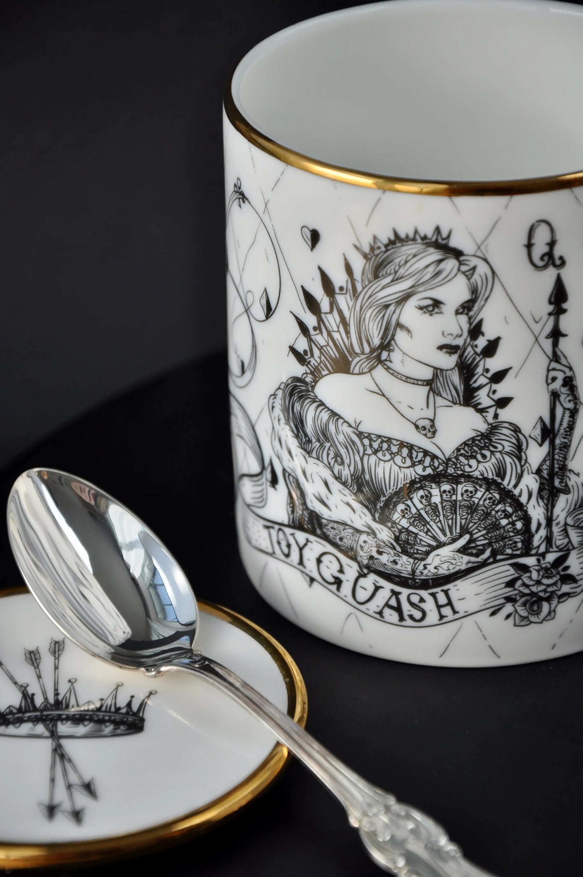 Small fine bone china dish used as a teaspoon rest beside a ceramic mug