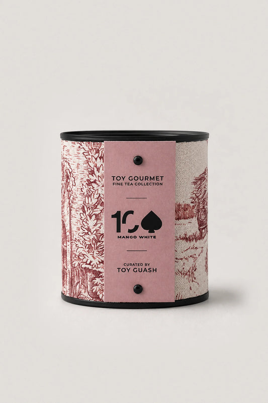 White tea with mango, loose leaf in fabric-wrapped tin, pale gold liquor, luxury tea by Toy Gourmet