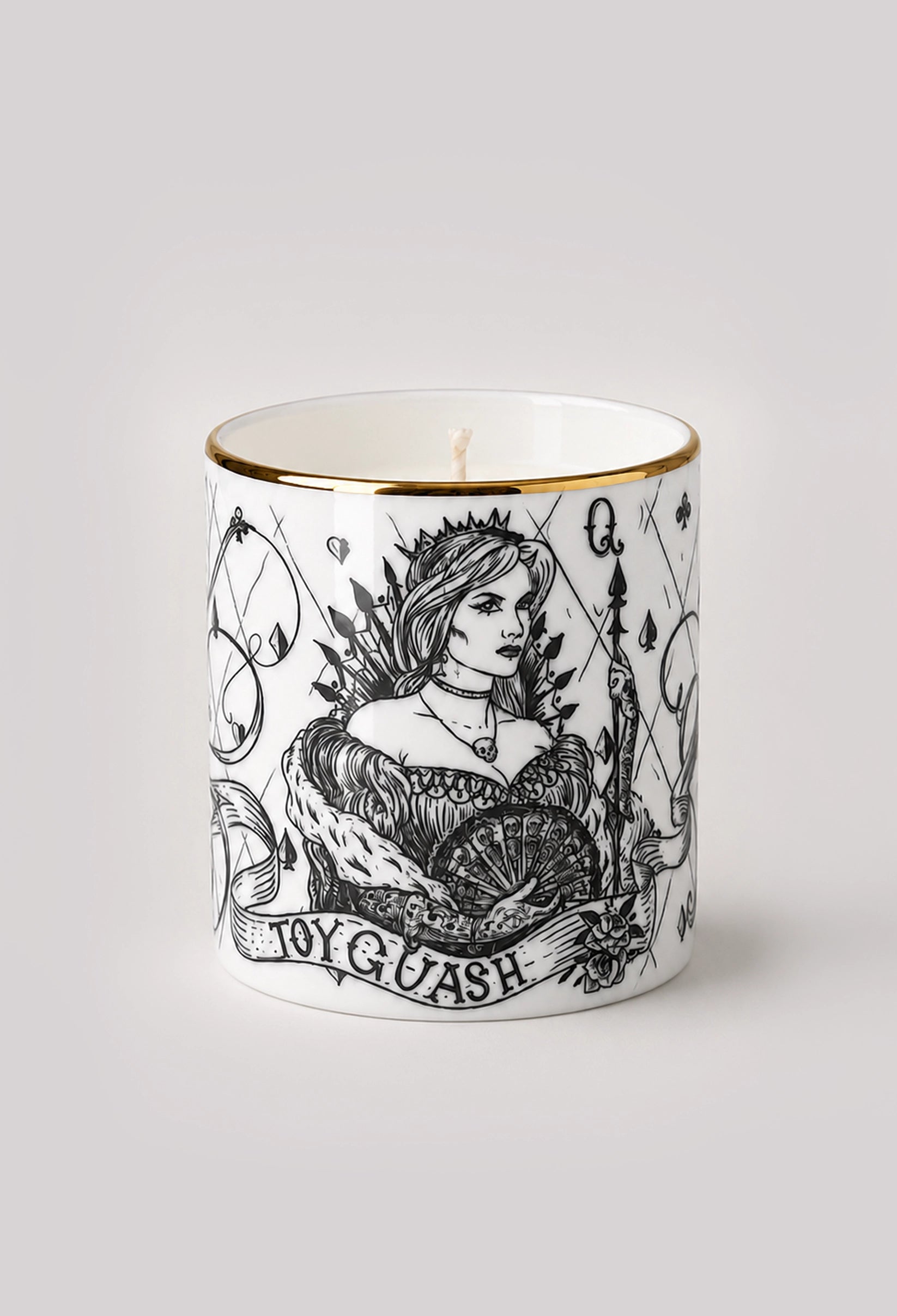 Pomegranate scented candle in a white fine bone china vessel with a hand-gilded 22ct gold rim