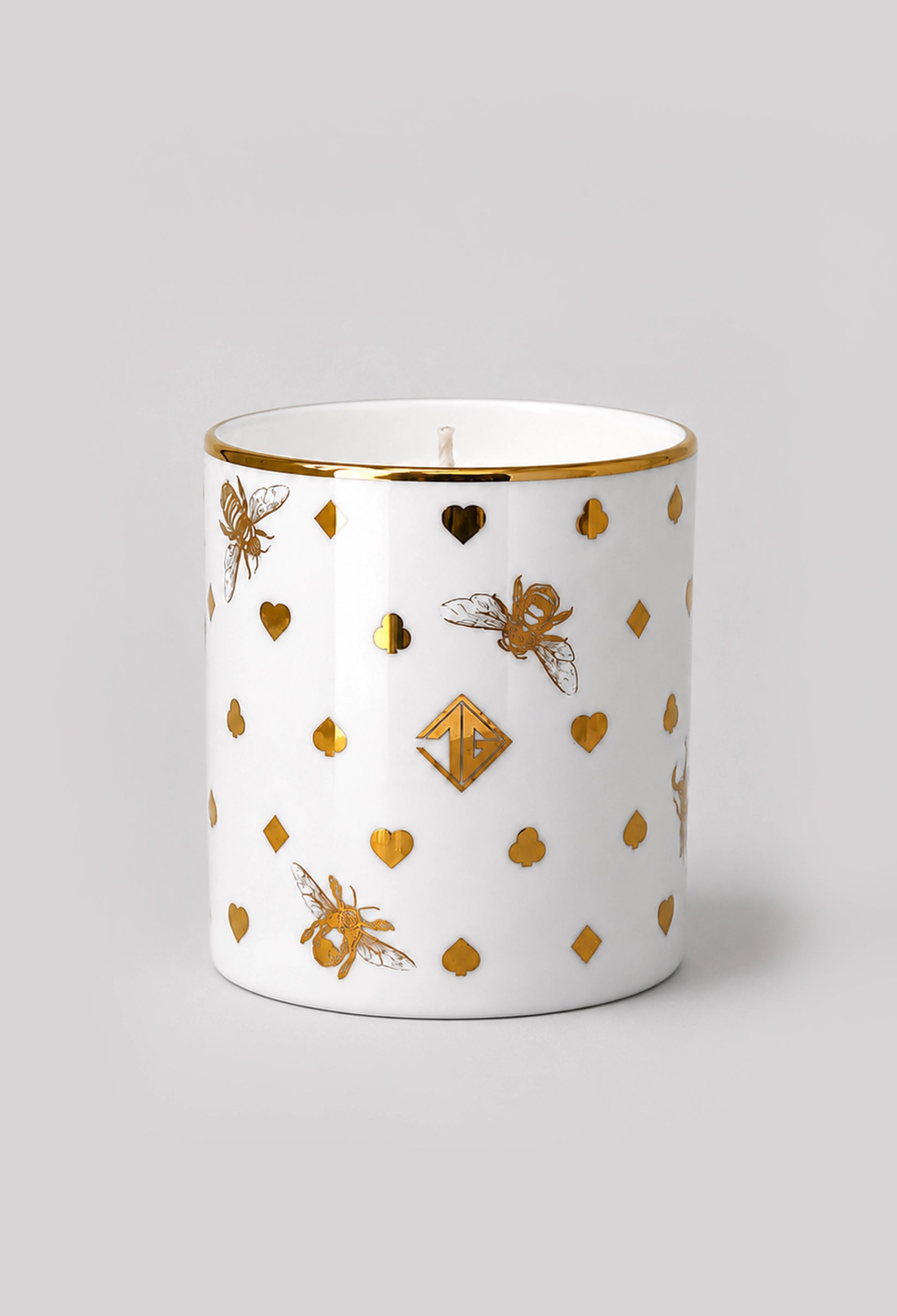 Woodland Smoke scented candle in a fine bone china vessel with 22ct gold details on a light grey background.