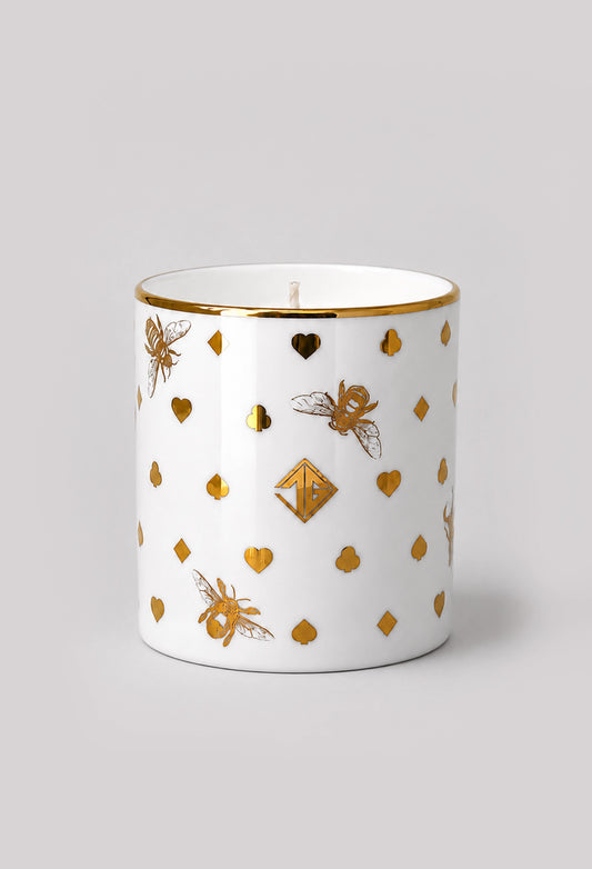 Woodland Smoke scented candle in a fine bone china vessel with 22ct gold details on a light grey background.